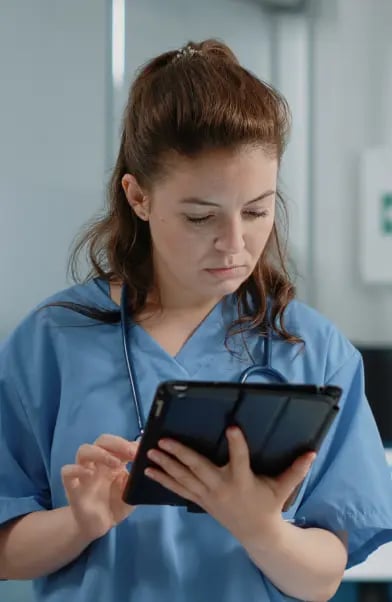 close-up-medical-assistant-looking-tablet-screen-with-information