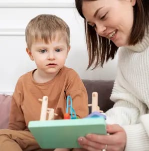 close-up-mother-kid-playing-with-toy