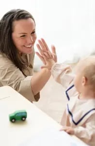 mother-baby-daughter-giving-high-fives