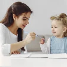 tutor-with-litthe-girl-studying-home