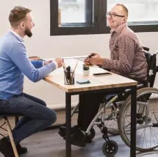 manager-working-together-with-disabled-worker