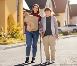 person-helping-their-elder-neighbour