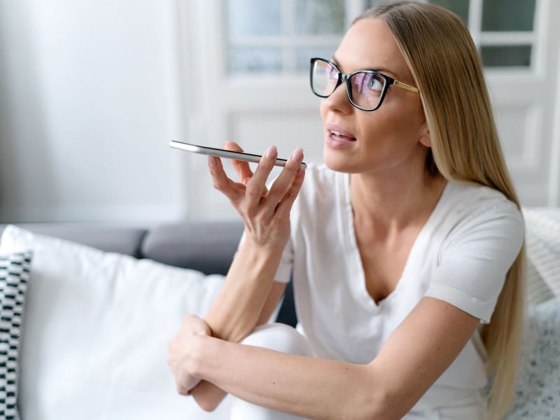 woman-speaks-into-phone-1
